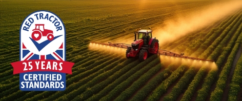 Tractor spraying a field
